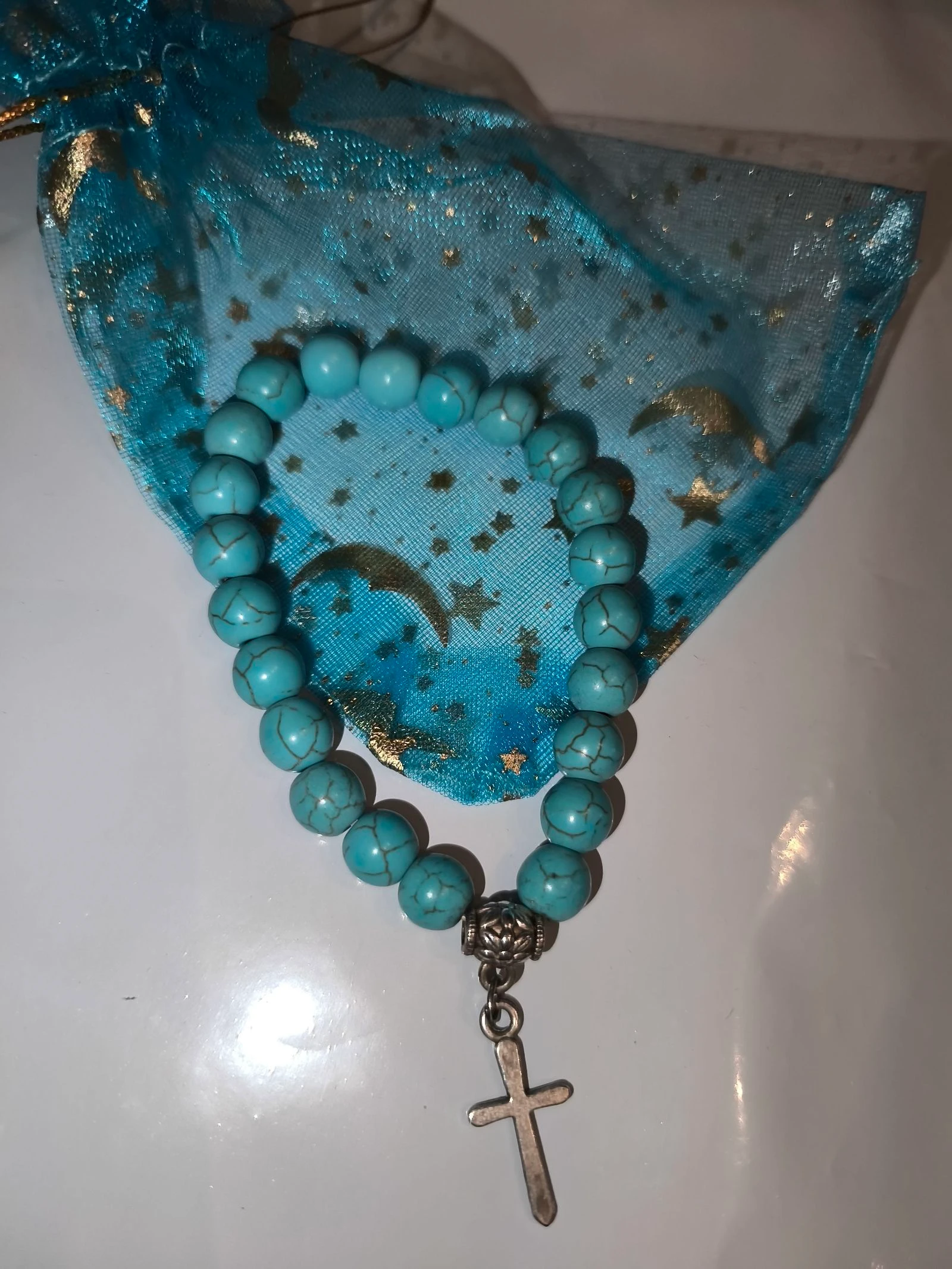 Bracelet perle élastique croix turquoise 